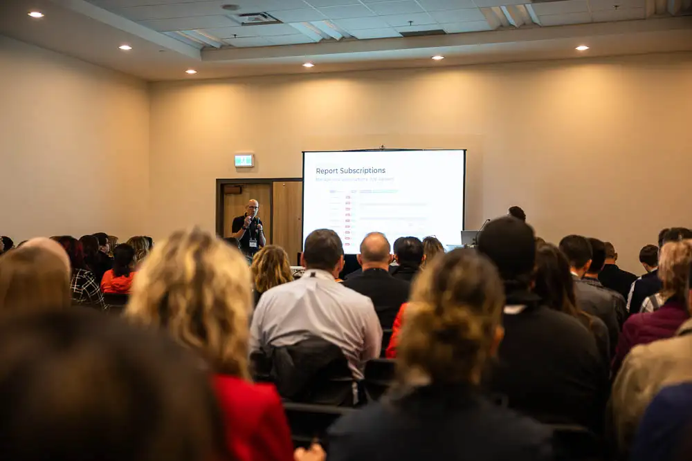 AbaData User Conference 2025 Images (7 of 20) showing a full room of attendees listening to a technical session on advanced features within AbaData Maps